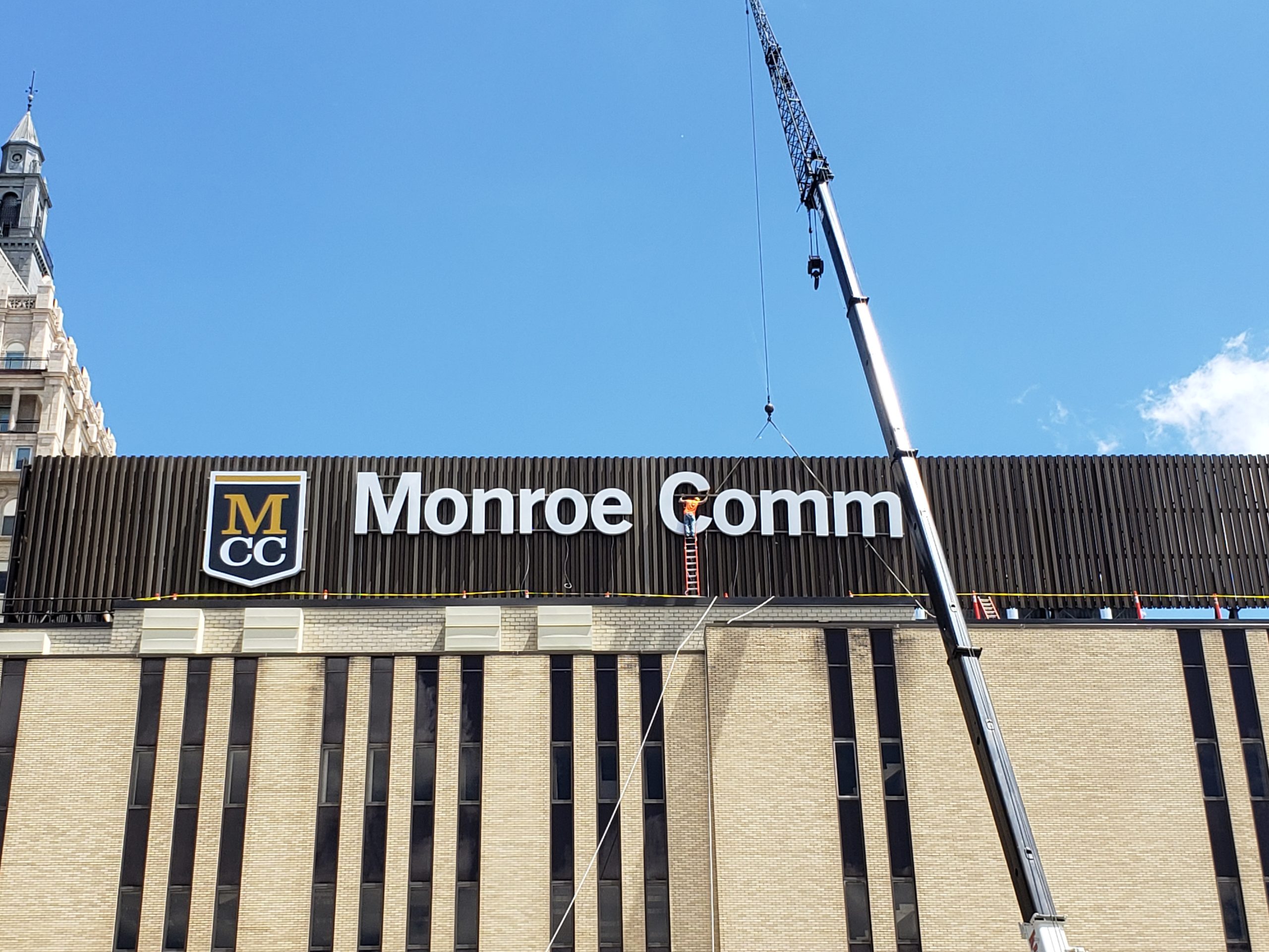 Monroe Community College sign on building
